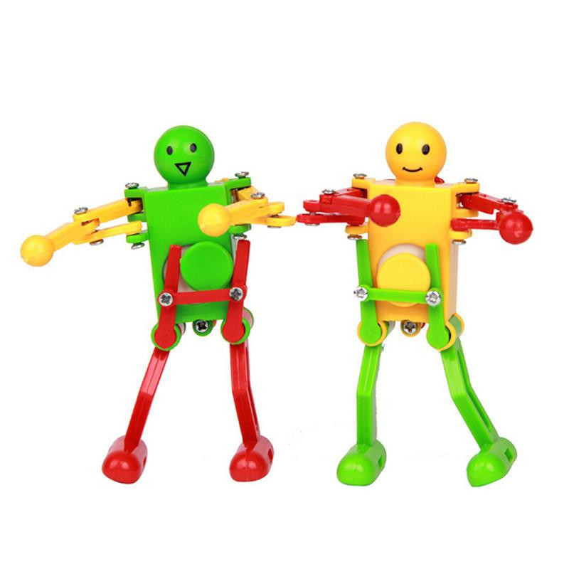 2pcs Massa Urverk Vår Vind Upp Leksak Dans Robot Leksak För Barn Barn Leksak Gul Grön Röd